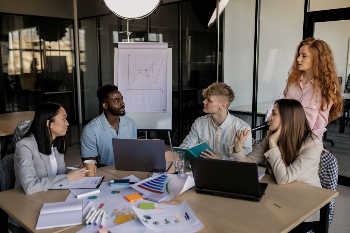 Marketing team planning a growth strategy around a conference table
