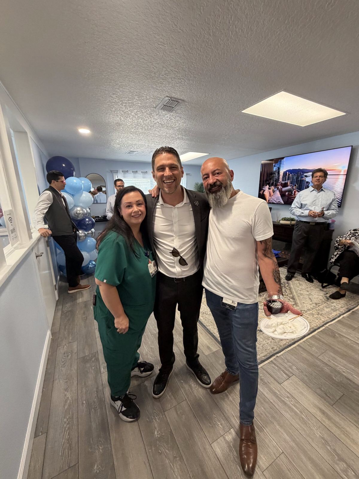 Justin Miller with a medical practice team in their office