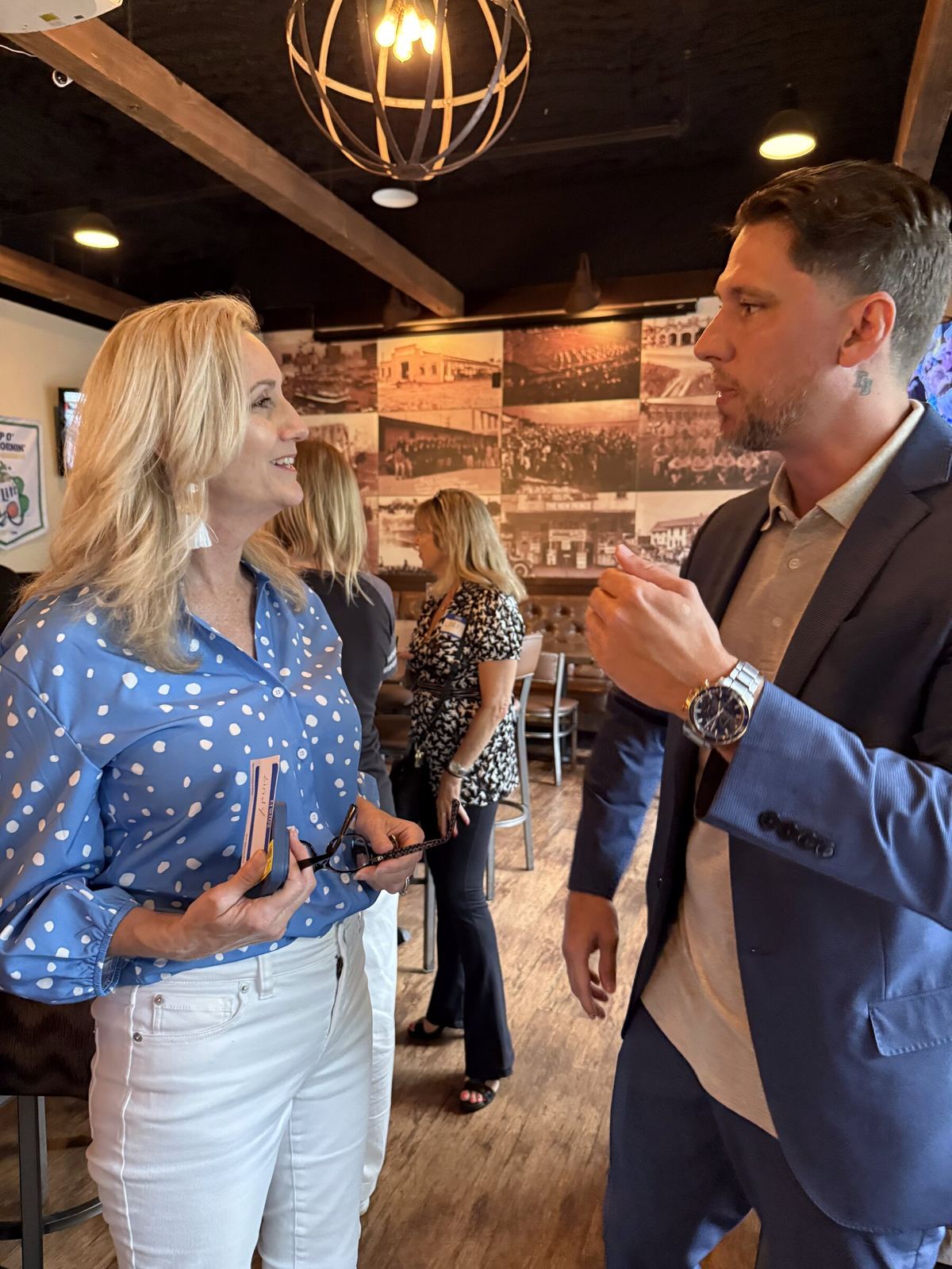 Justin Miller in conversation at a Tampa Bay business networking event