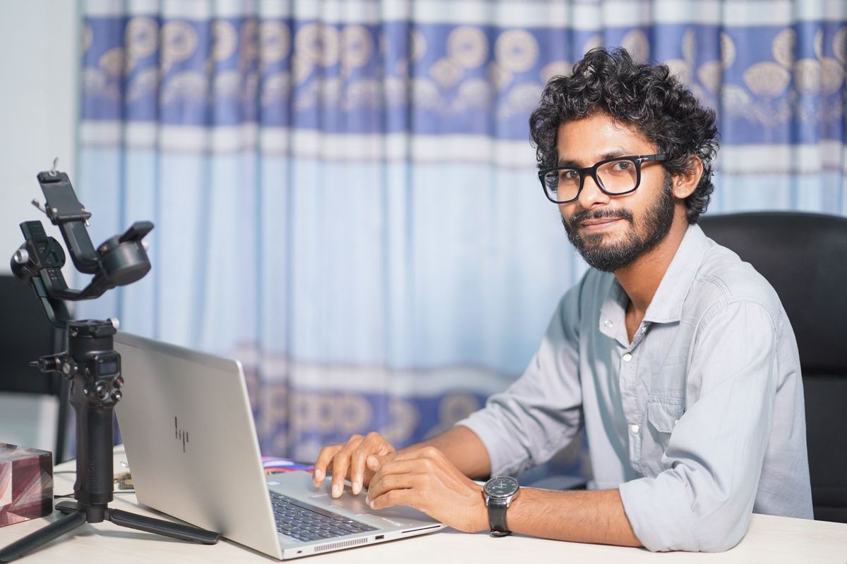 Web designer working on a website at a laptop